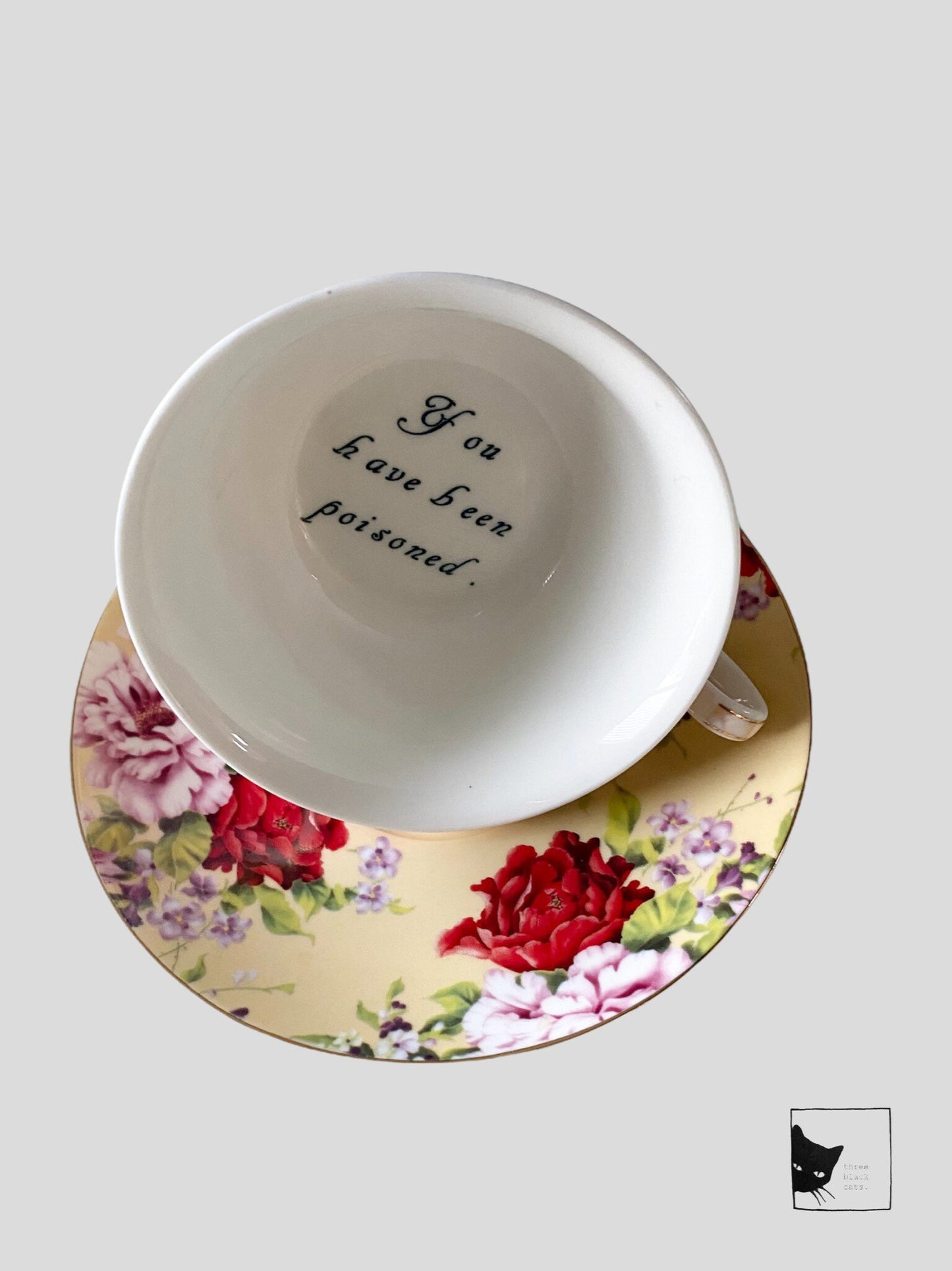 You've been Poisoned Tea Cup & Bye Saucer, Yellow and Red Rose Floral Pattern