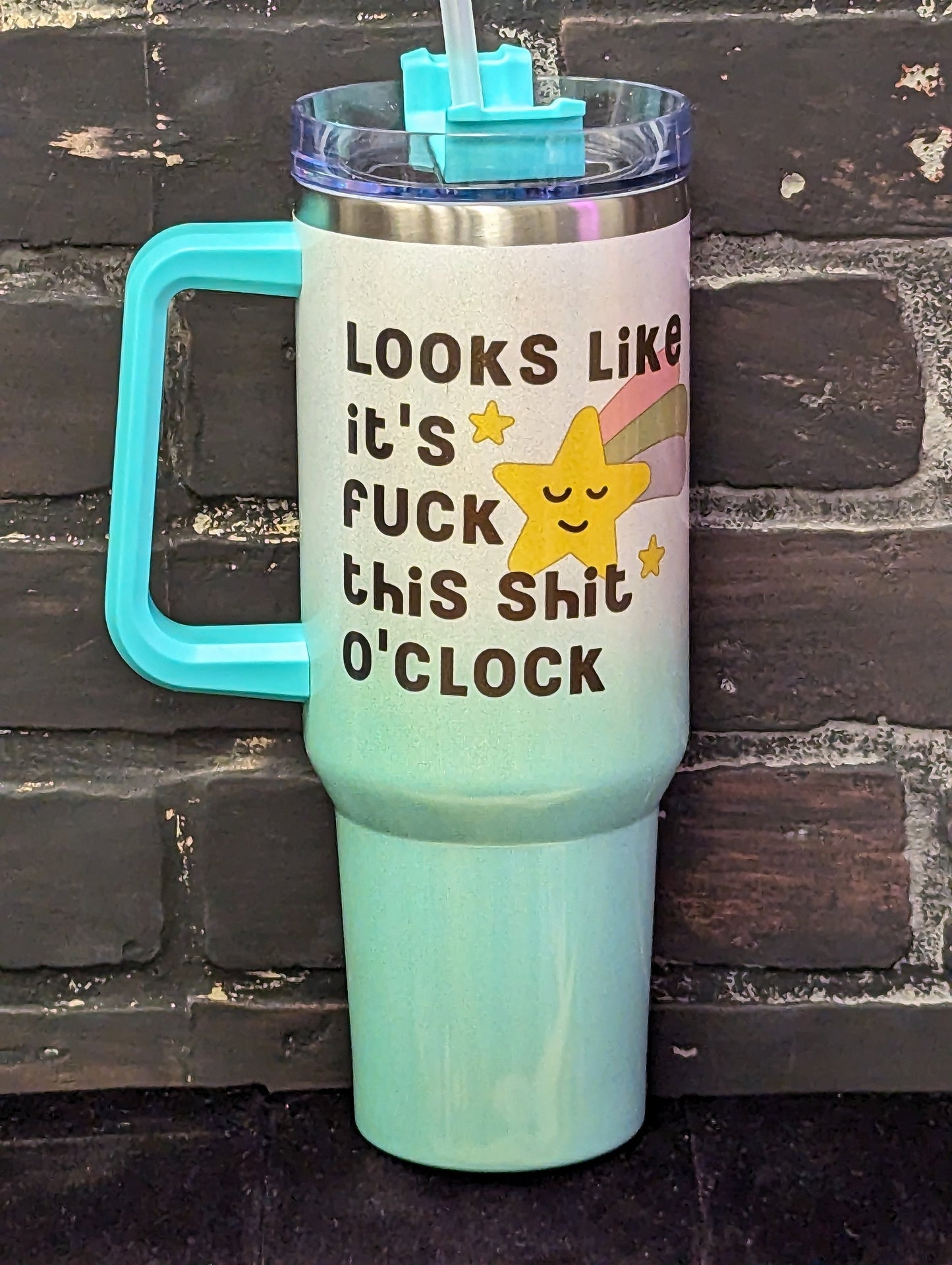 Looks like it's fuck this shit o clock, 40oz green Shimmer Tumbler w/handle and straw
